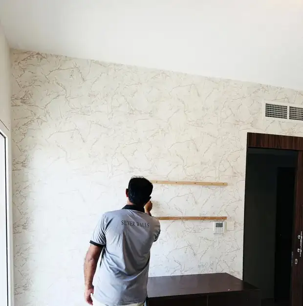 Silver Walls team installing wallpaper