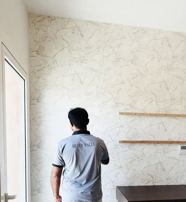 Silver Walls installer at work